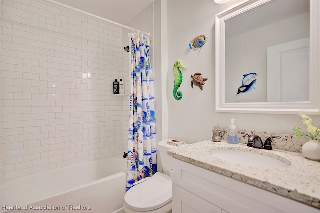 full bathroom featuring vanity, toilet, and shower / bath combo with shower curtain