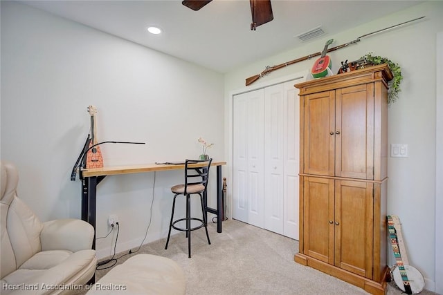 office with light colored carpet and ceiling fan