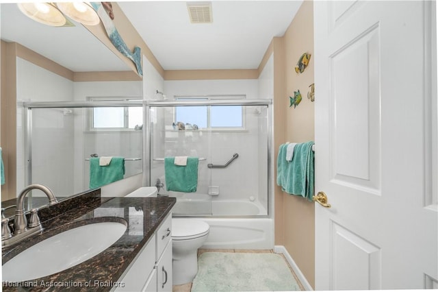 full bathroom with toilet, vanity, and combined bath / shower with glass door