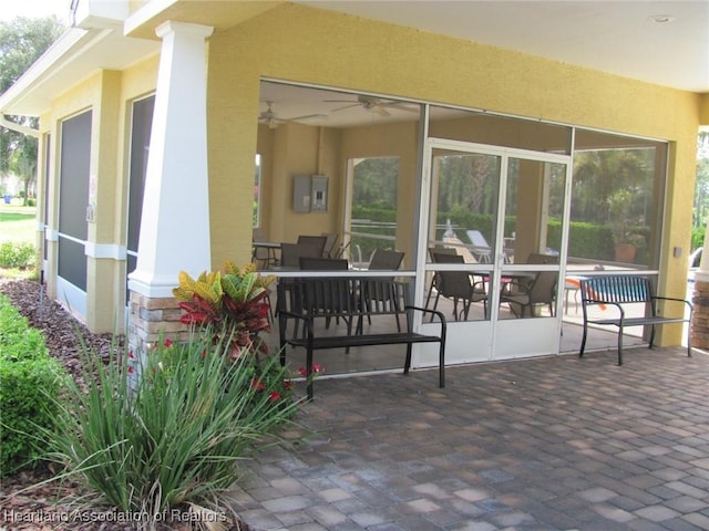 view of patio with a sunroom