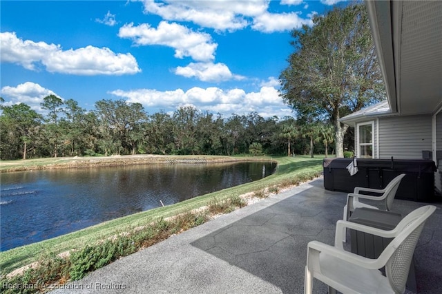 view of patio featuring a water view