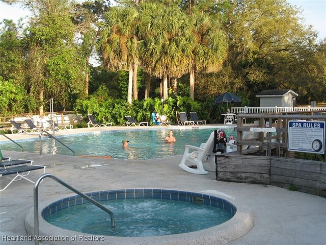 view of pool featuring a community hot tub