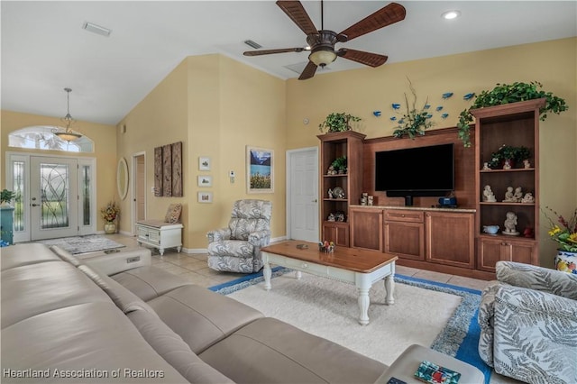 living room featuring ceiling fan and light tile patterned flooring