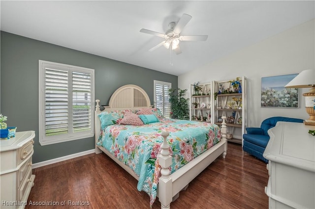 bedroom with ceiling fan and dark hardwood / wood-style floors