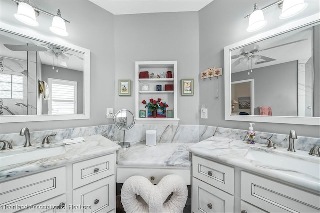 bathroom with ceiling fan, built in features, and vanity