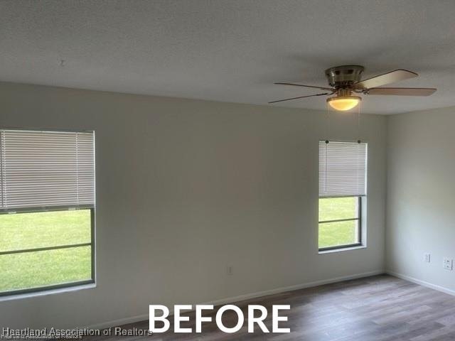 spare room with a ceiling fan, a textured ceiling, baseboards, and wood finished floors