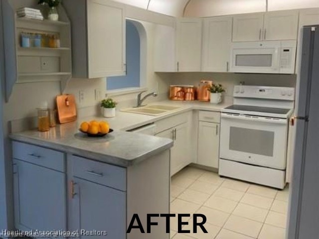 kitchen with white appliances, light tile patterned floors, white cabinets, open shelves, and a sink