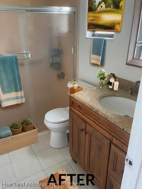 full bathroom featuring tile patterned flooring, a shower with door, vanity, and toilet