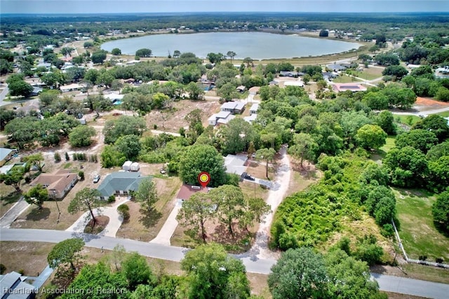 drone / aerial view with a water view and a residential view