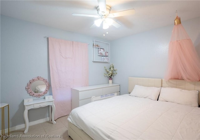 bedroom featuring light tile patterned floors and ceiling fan