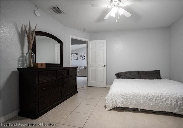 bedroom featuring ceiling fan and light tile patterned flooring