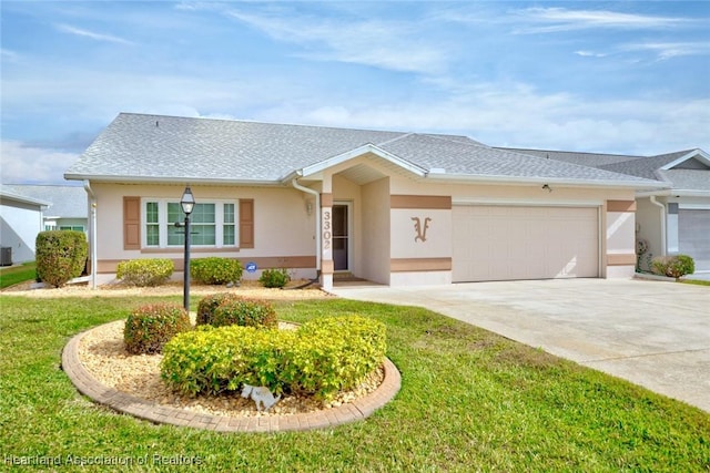 ranch-style house featuring cooling unit, a garage, and a front lawn