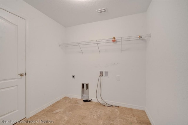 laundry room featuring washer hookup and electric dryer hookup