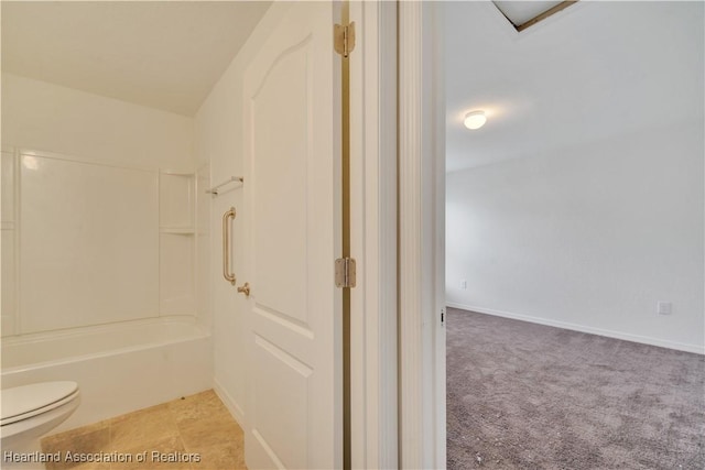 bathroom with tub / shower combination and toilet