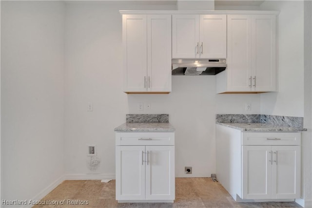 laundry room with cabinets and hookup for an electric dryer