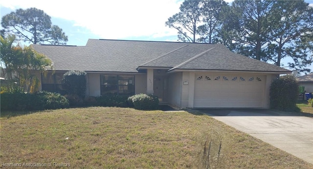 ranch-style home with a garage and a front yard