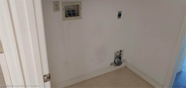 clothes washing area with hookup for an electric dryer, hookup for a washing machine, and light tile patterned floors