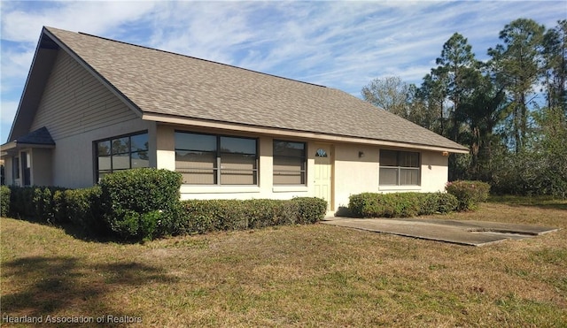 view of front of property with a front lawn