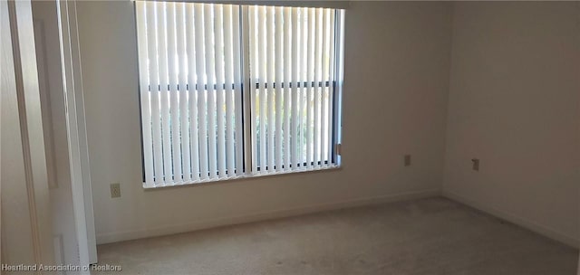 unfurnished room with carpet flooring