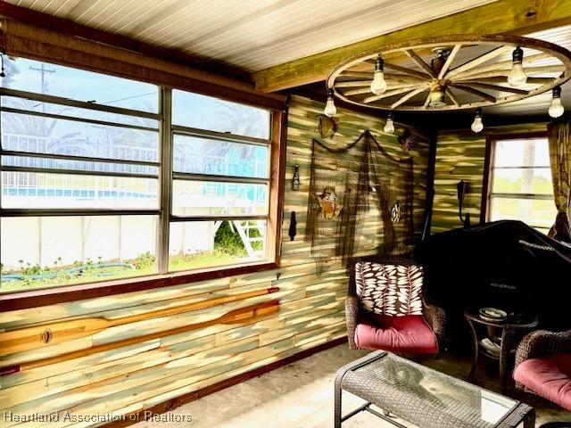 living area with concrete flooring and a wealth of natural light