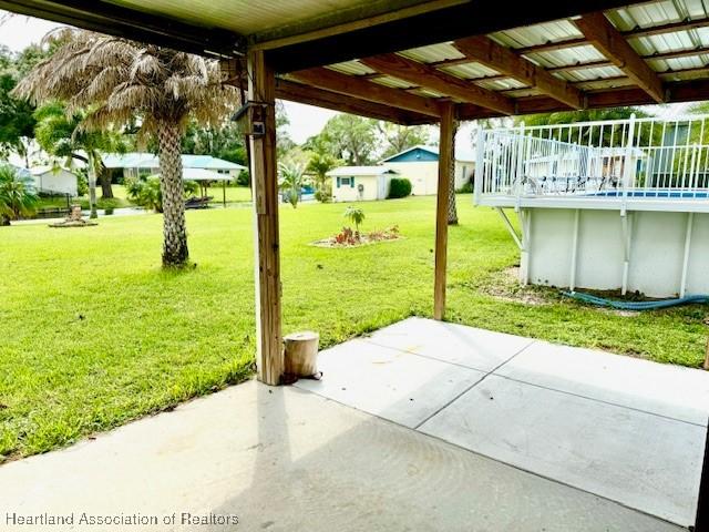 exterior space featuring a swimming pool side deck and a patio