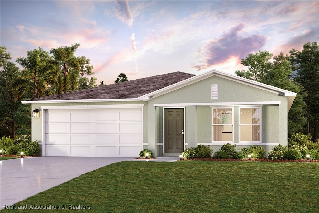 single story home featuring a lawn, an attached garage, stucco siding, and concrete driveway