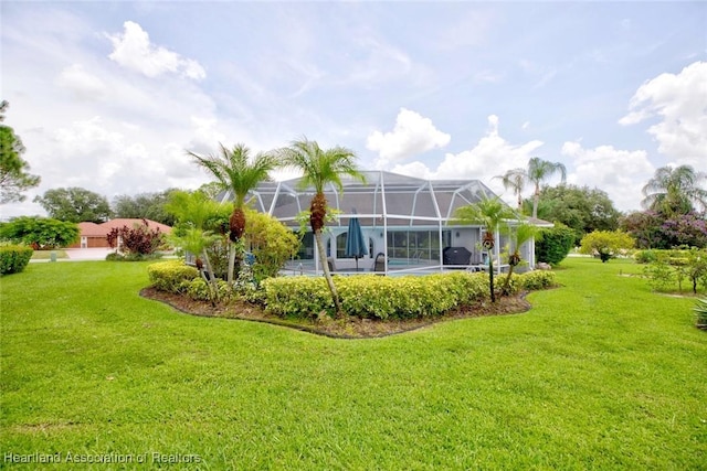 view of yard with a lanai