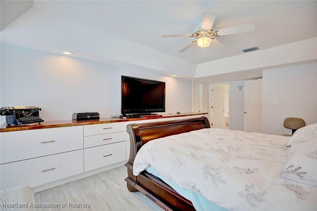 bedroom with ceiling fan and light hardwood / wood-style flooring