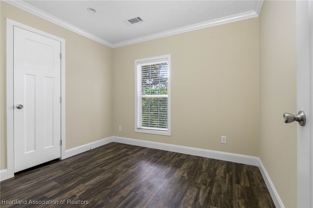 317 Old Bradenton Rd, Wauchula, FL 33873 - spare room featuring dark wood-style flooring, baseboards, and ornamental molding