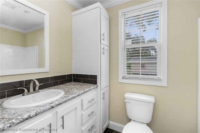 317 Old Bradenton Rd, Wauchula, FL 33873 - bathroom with ornamental molding, vanity, and toilet