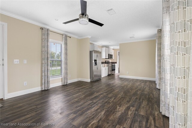 317 Old Bradenton Rd, Wauchula, FL 33873 - unfurnished living room featuring a ceiling fan, dark wood-style floors, crown molding, and baseboards