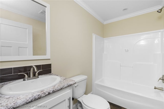 317 Old Bradenton Rd, Wauchula, FL 33873 - full bathroom featuring ornamental molding, toilet, vanity, bathing tub / shower combination, and tasteful backsplash