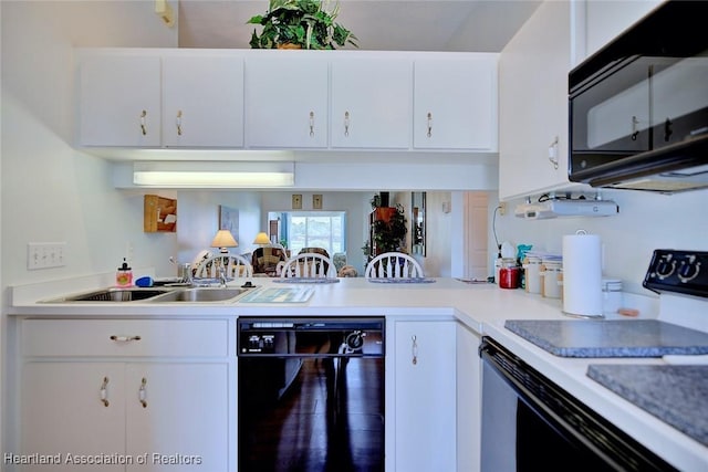 808 Chelsee Way, Lake Placid, FL 33852 - kitchen featuring black appliances, white cabinets, light countertops, and a peninsula