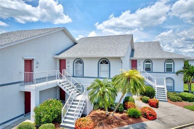 808 Chelsee Way, Lake Placid, FL 33852 - multi unit property with stairway, a shingled roof, stucco siding, and driveway