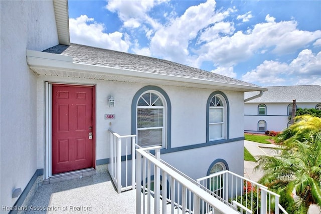 808 Chelsee Way, Lake Placid, FL 33852 - property entrance with stucco siding and a shingled roof