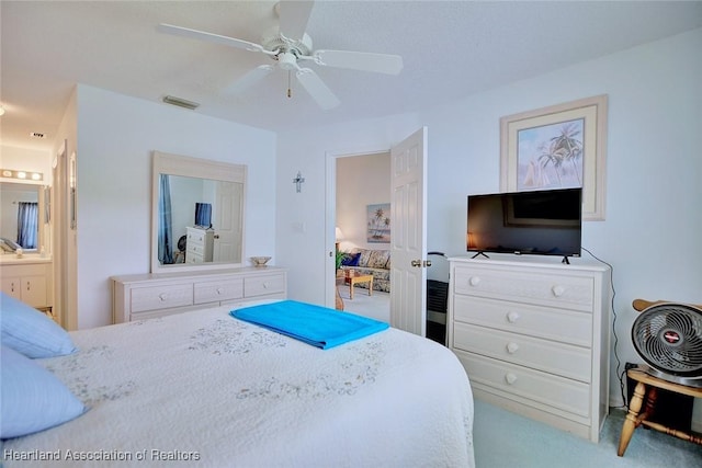 808 Chelsee Way, Lake Placid, FL 33852 - carpeted bedroom with connected bathroom and ceiling fan