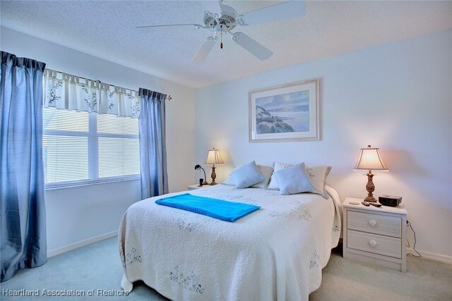 808 Chelsee Way, Lake Placid, FL 33852 - bedroom featuring light carpet, a ceiling fan, and a textured ceiling