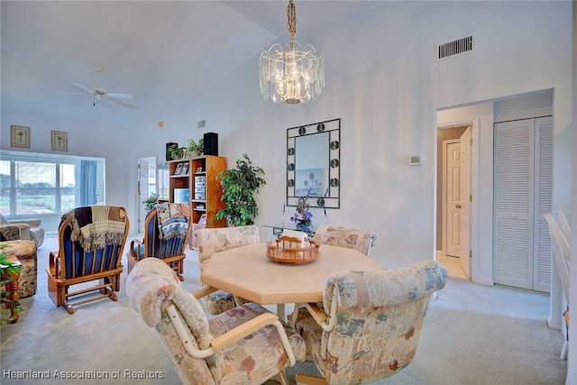 808 Chelsee Way, Lake Placid, FL 33852 - dining area featuring light carpet, high vaulted ceiling, a chandelier, and a ceiling fan
