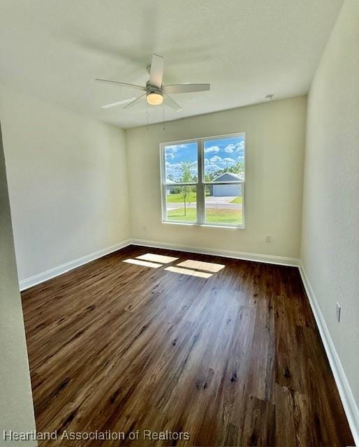 5277 Pebble Dr, Sebring, FL 33872 - empty room with baseboards, a ceiling fan, and dark wood-style flooring