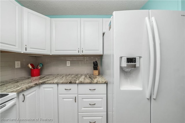 kitchen with white appliances, decorative backsplash, a textured ceiling, light stone counters, and white cabinetry