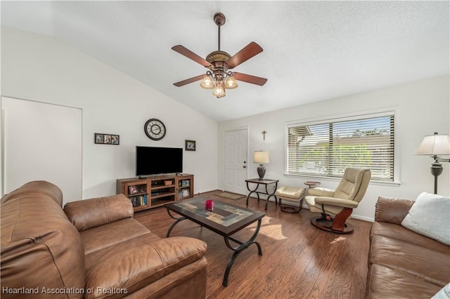 living room featuring a textured ceiling, ceiling fan, vaulted ceiling, and hardwood / wood-style flooring