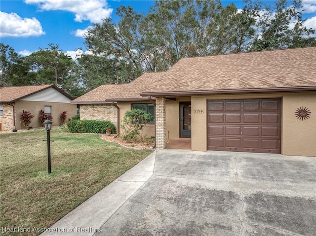 ranch-style home featuring a garage and a front yard