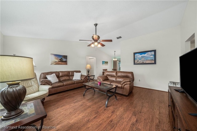 living room featuring lofted ceiling, ceiling fan, and dark hardwood / wood-style floors