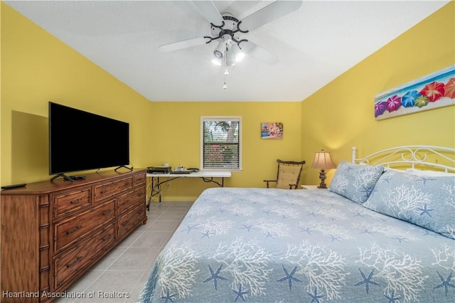 bedroom featuring light tile patterned floors and ceiling fan