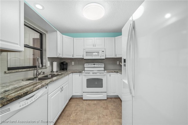 kitchen featuring white cabinets, white appliances, and sink