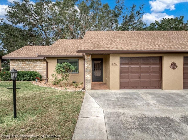 ranch-style house with a garage and a front lawn