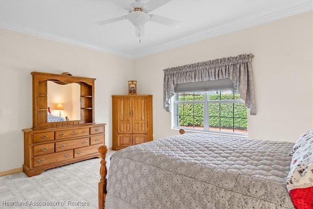 bedroom with light colored carpet, ceiling fan, and ornamental molding