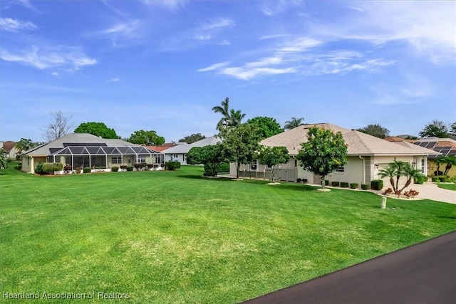 view of yard featuring glass enclosure