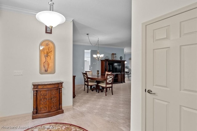 tiled dining space featuring crown molding and a notable chandelier