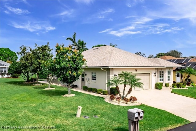 view of front facade with a garage and a front lawn